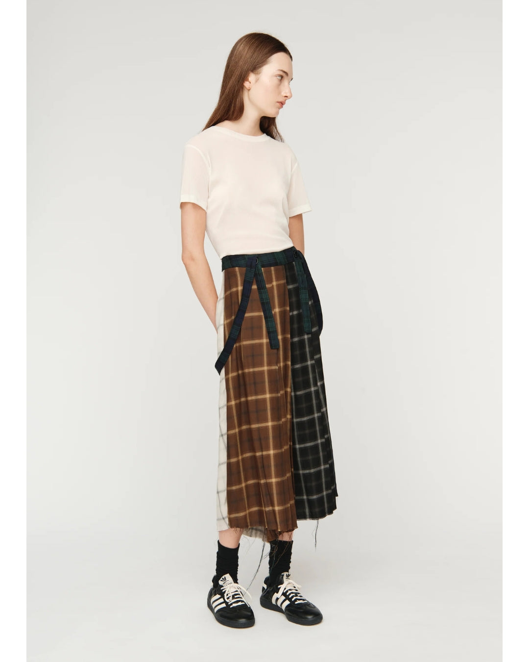 Song for the Mute Pleated Skirt, three-quarter view showing full silhouette and multi-tartan construction