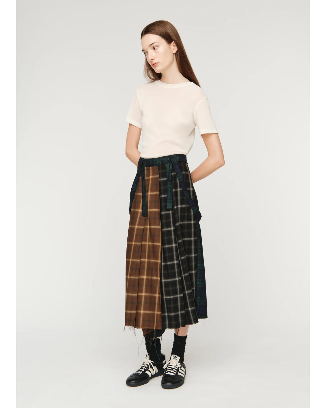 Song for the Mute Pleated Skirt, front view showing contrast strap detail at waist