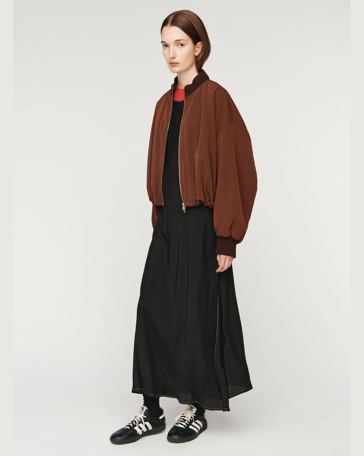 Song for the Mute Elasticated Egg Bomber in Brown, side view styled with black dress