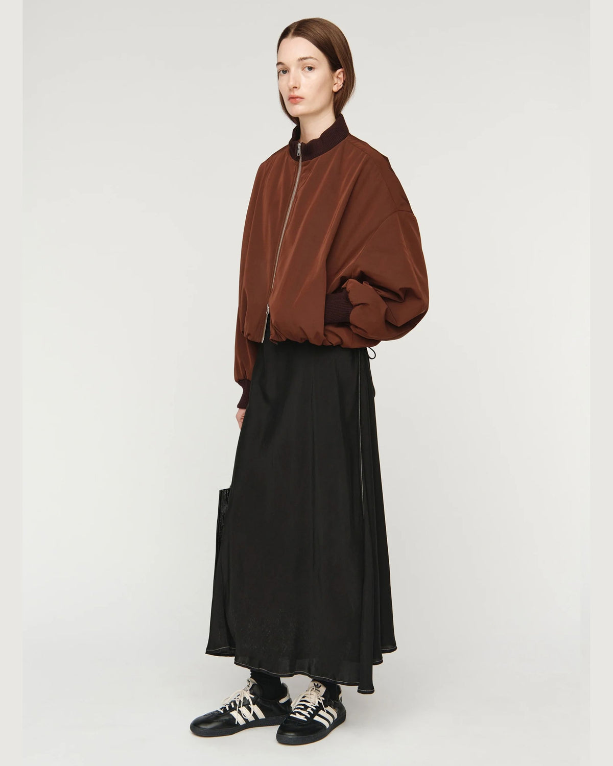 Song for the Mute Elasticated Egg Bomber in Brown, side view styled with black skirt