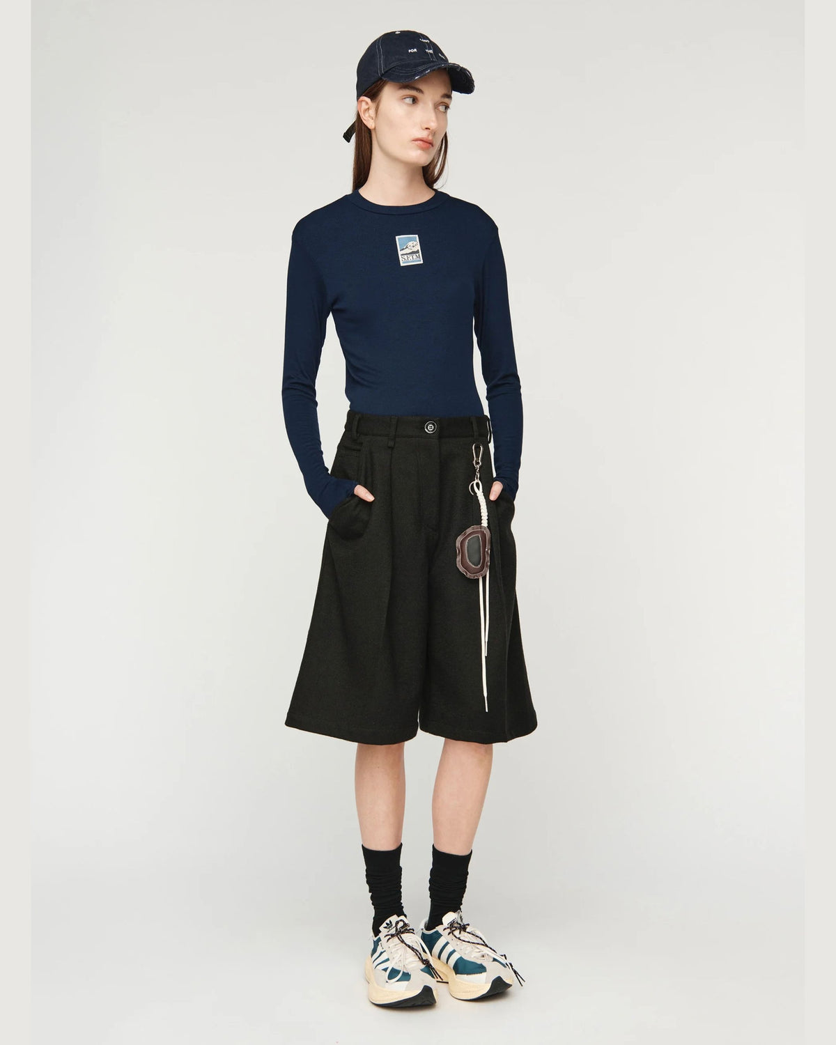 Song for the Mute Super Baggy Short in Petrol Black, three-quarter view on model