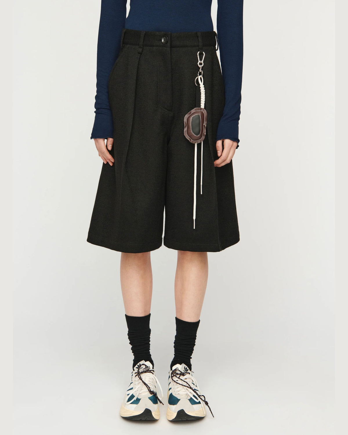 Song for the Mute Super Baggy Short in Petrol Black, close front view on model looking away
