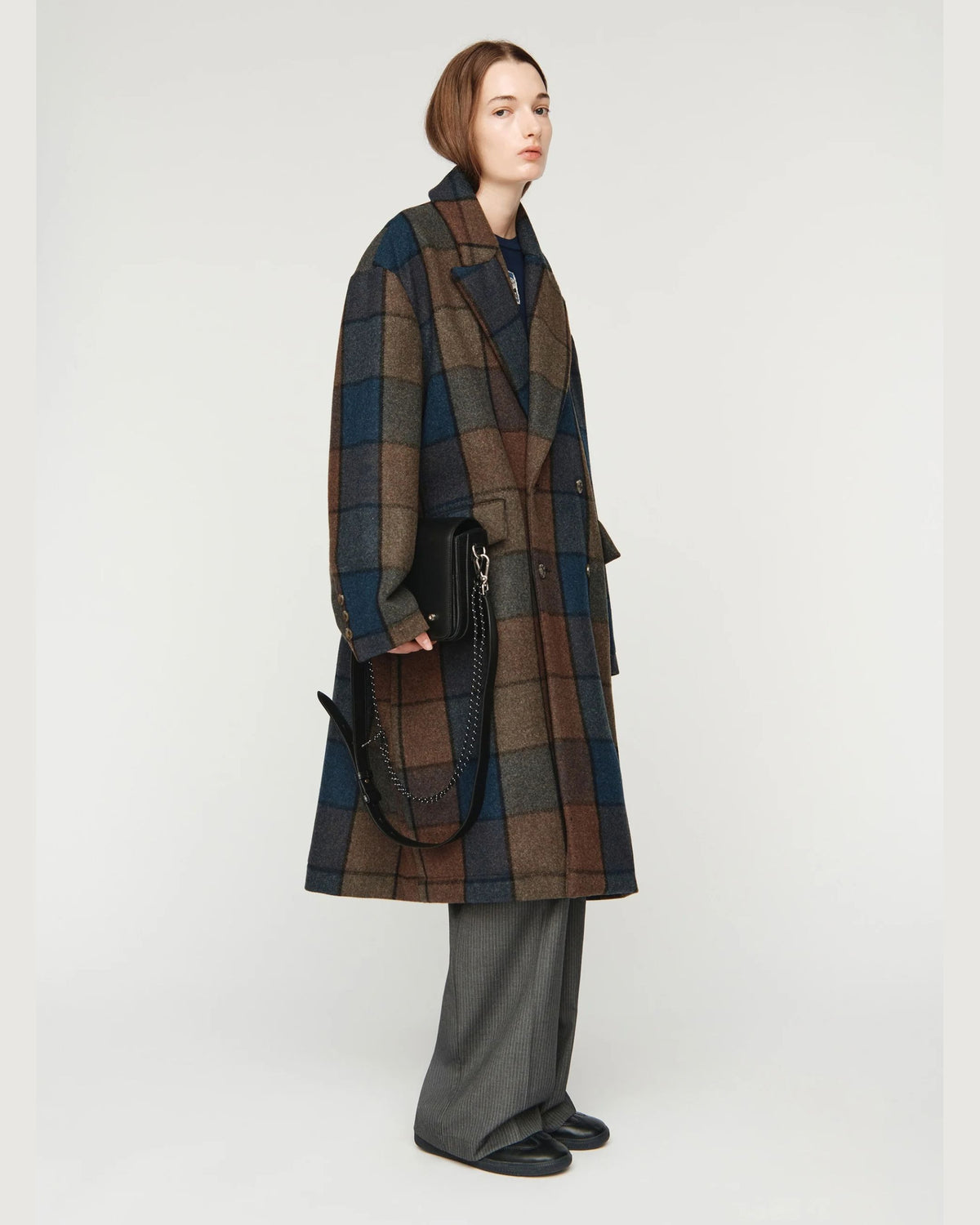 Song for the Mute Double Breasted Overcoat in Bear Check, side view close on model