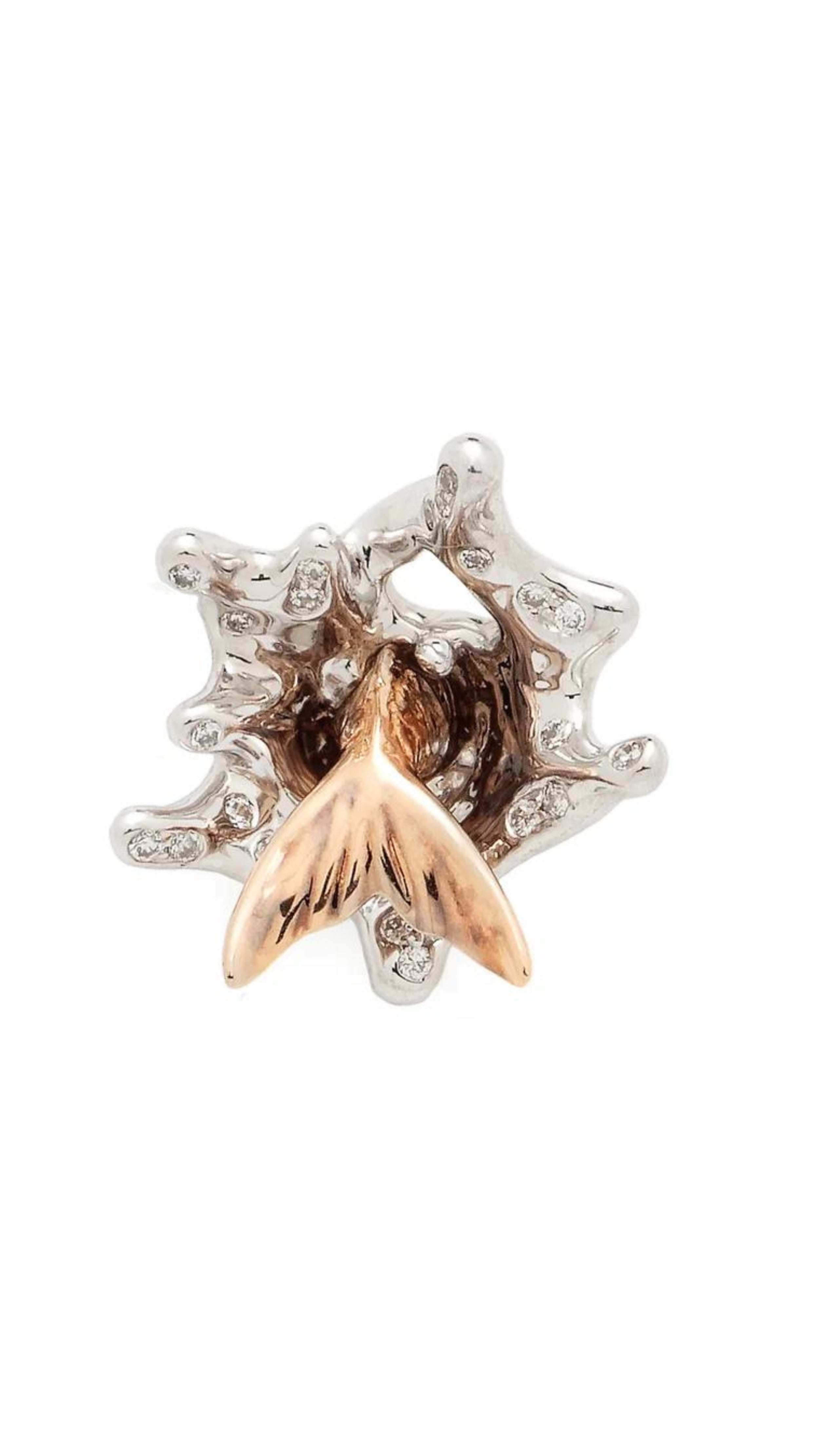 Bibi van der Velden Splash Stud. This sculptural earring is crafted from 18k white and rose gold with tiny diamond accents that evoke the sea's foamy waves. Shown from the front.
