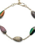 Bibi van der Velden Scarab Multi Color Bracelet. Five scarabs charms connected with 18k yellow gold and sterling silver chains form this charm bracelet.  Each scarabs featured here are set with real scarab wings, brown diamonds, blue sapphires, and tsavorites. Bracelet shown from top view.