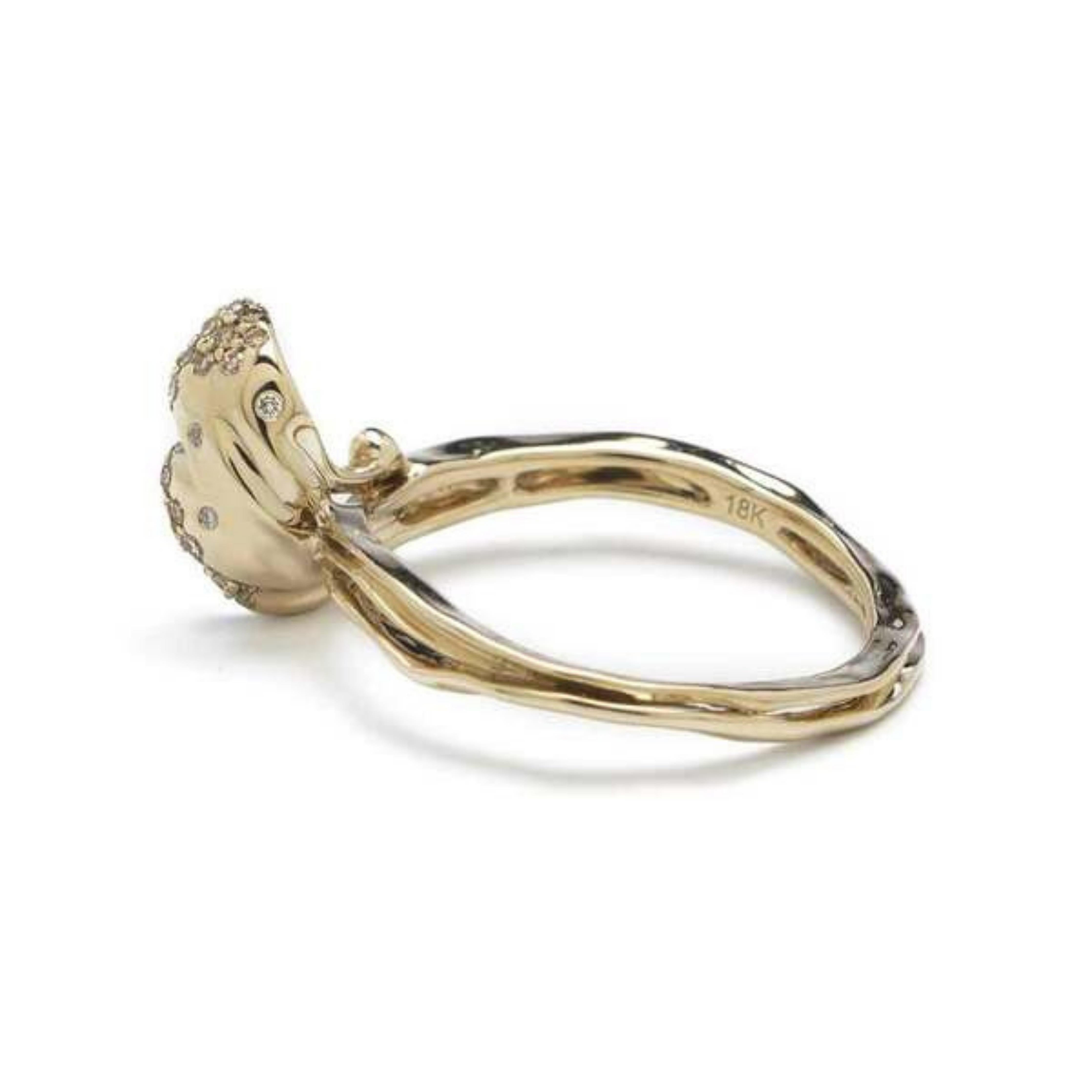 Wave Stackable Rings are three rings that can be snapped together to be worn as one piece, or purchased and worn as individual rings. Designed in pure 18k white gold, which has a slightly yellow tone, the rings are set with light brown and white diamonds Shown from interior.