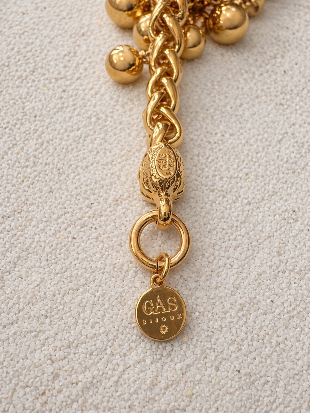 Gas Bijoux engraved clasp and logo charm detail on Stellar Bracelet gold chain