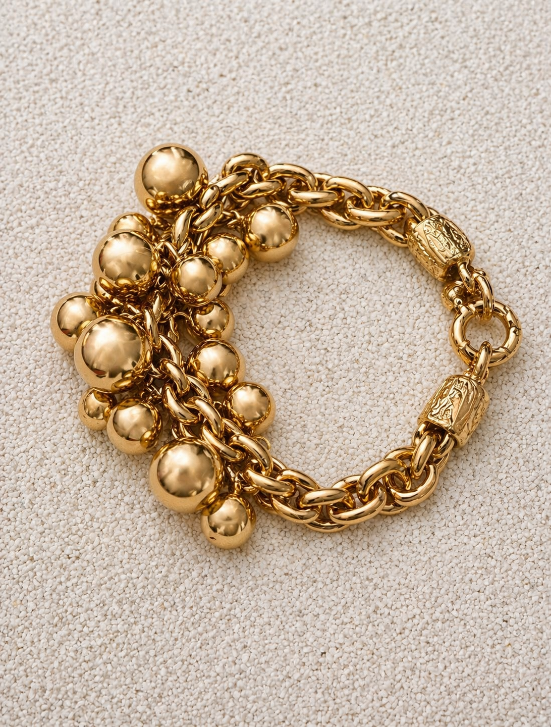 Françoise x Gas Bijoux Stellar Bracelet in gold, close-up detail of polished sphere cluster on wheat-link chain
