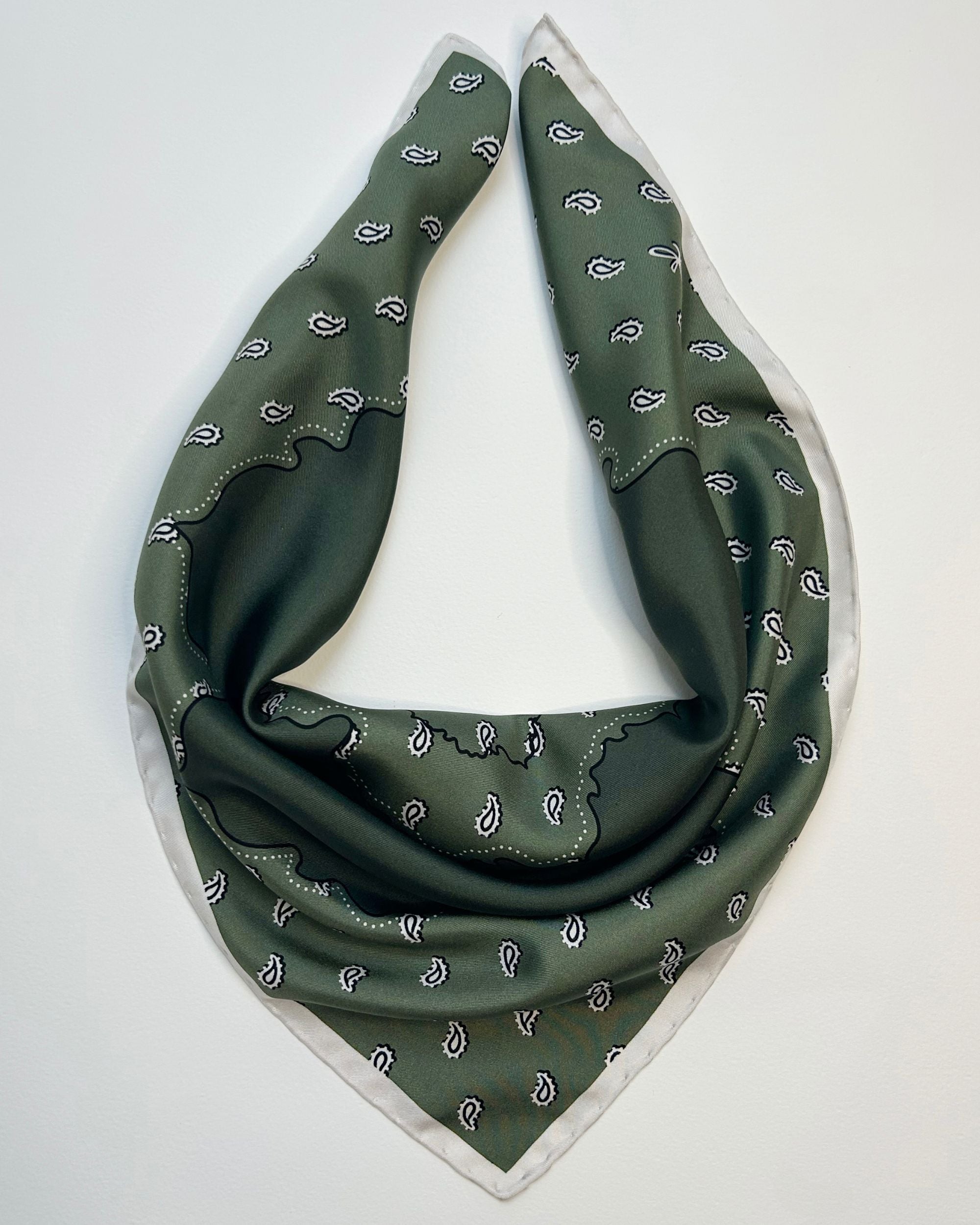Olive green silk bandana scarf draped flat
