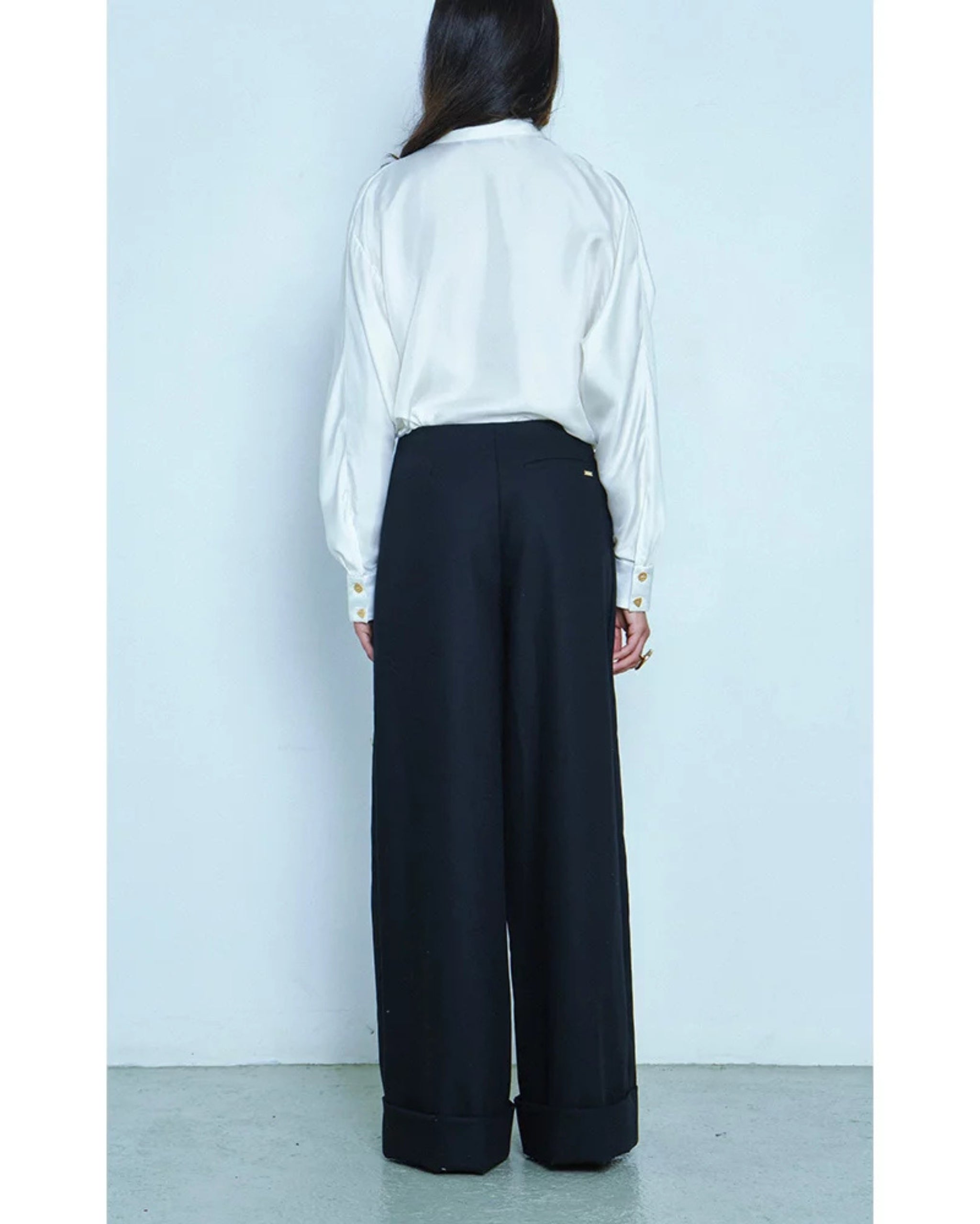 Rear view on model showing cuffed hem and structure