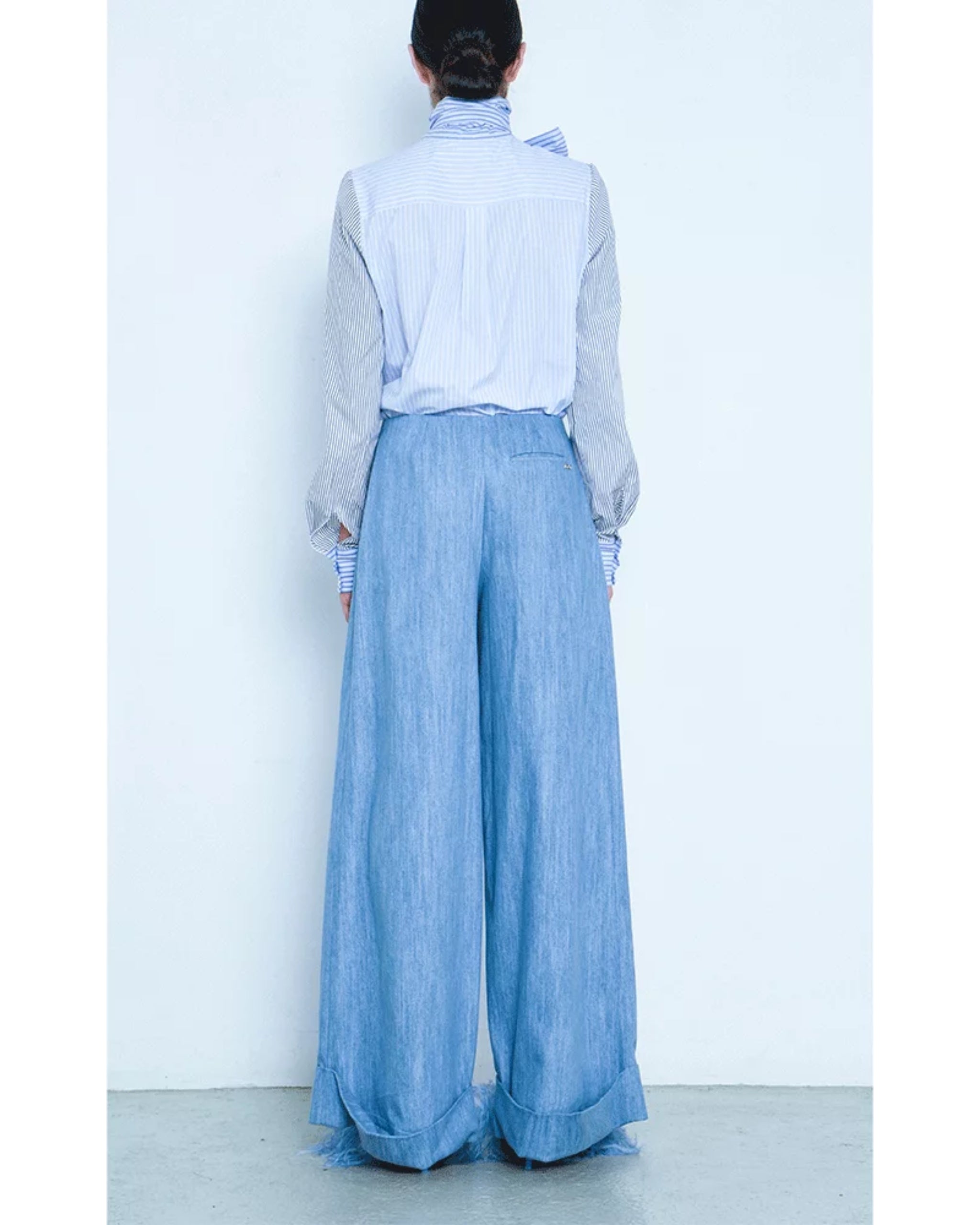 Rear view on model showing relaxed fit and stripe detail