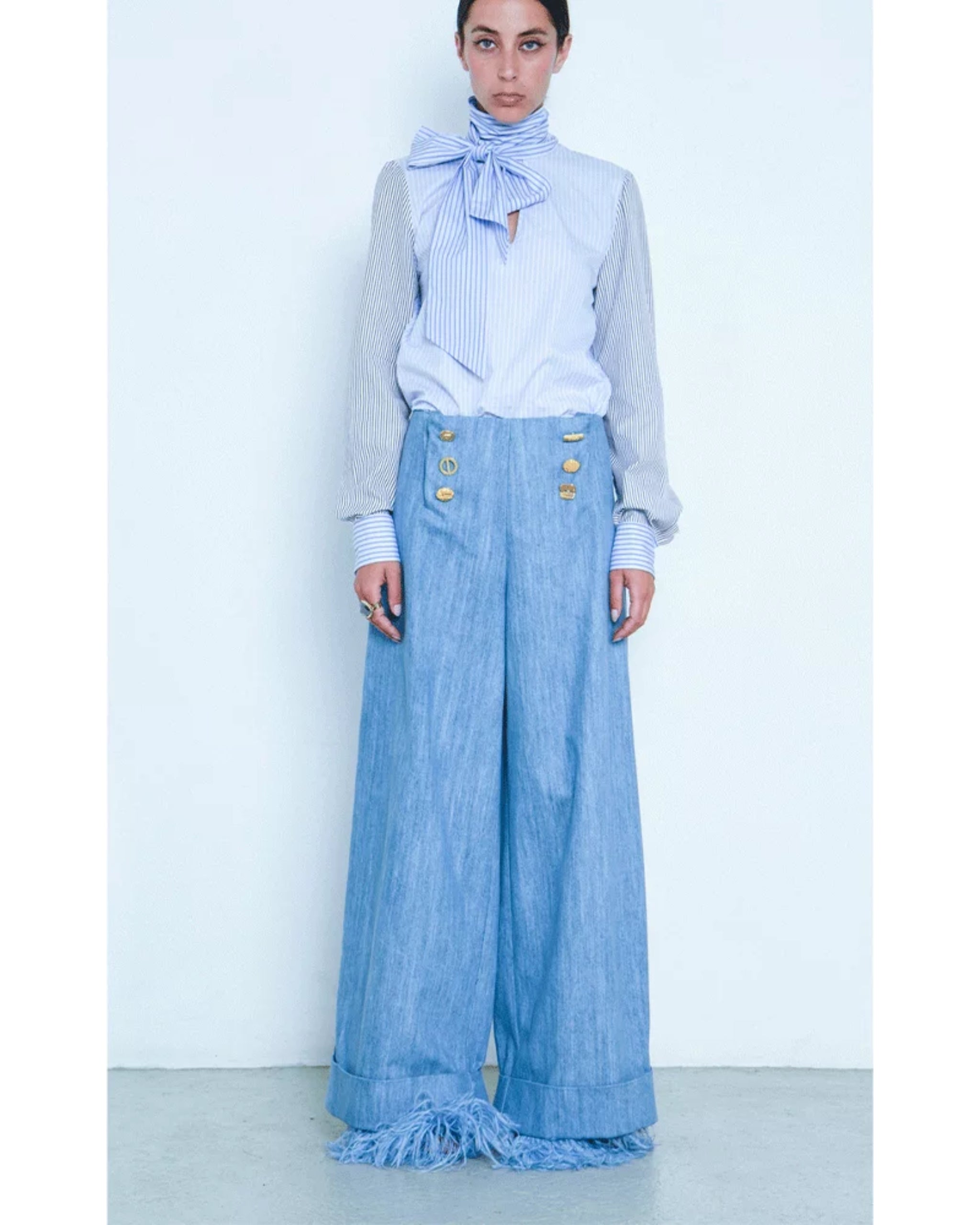 Model wearing Françoise Lucie Pussy-Bow Blouse styled with high-waist trousers