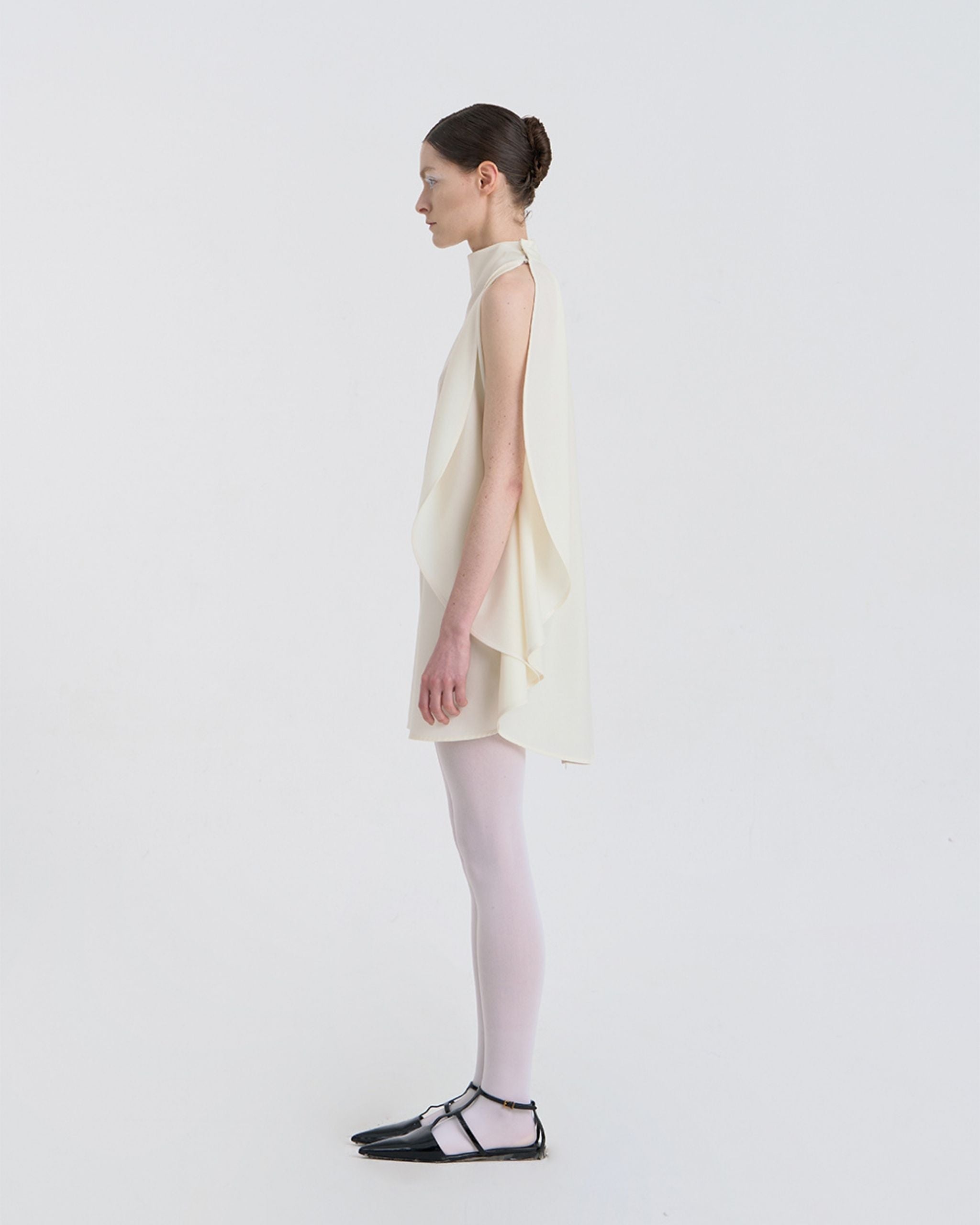 JINSUN Filante Cape Blouse side view showing cape drape and neckline.