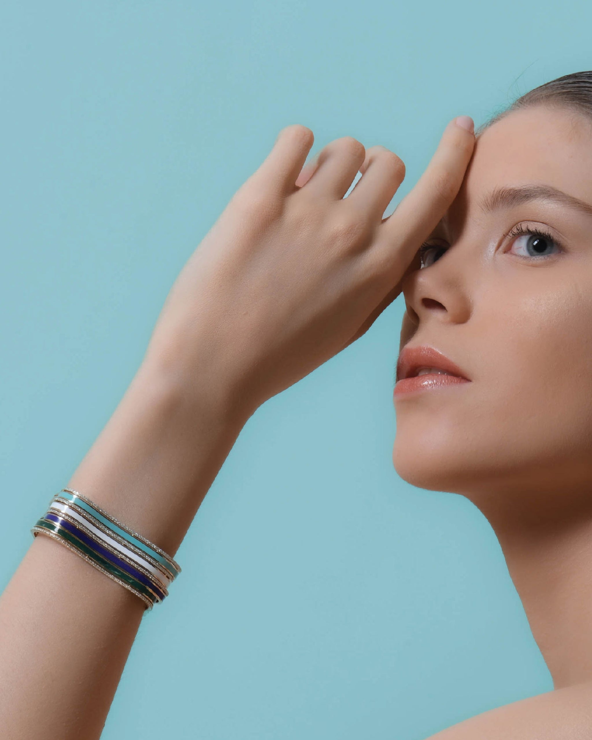 Sea Ice Bangle stacked on wrist — 18k gold with enamel and diamonds