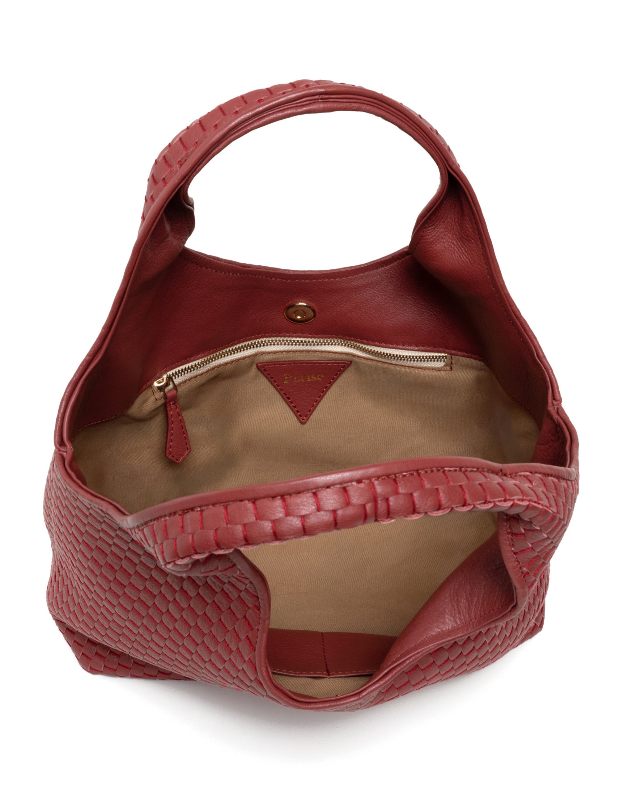 Inside of the Parise ‘1312’ Handbag in Chianti featuring soft cotton lining, internal zip pocket, and leather compartments.