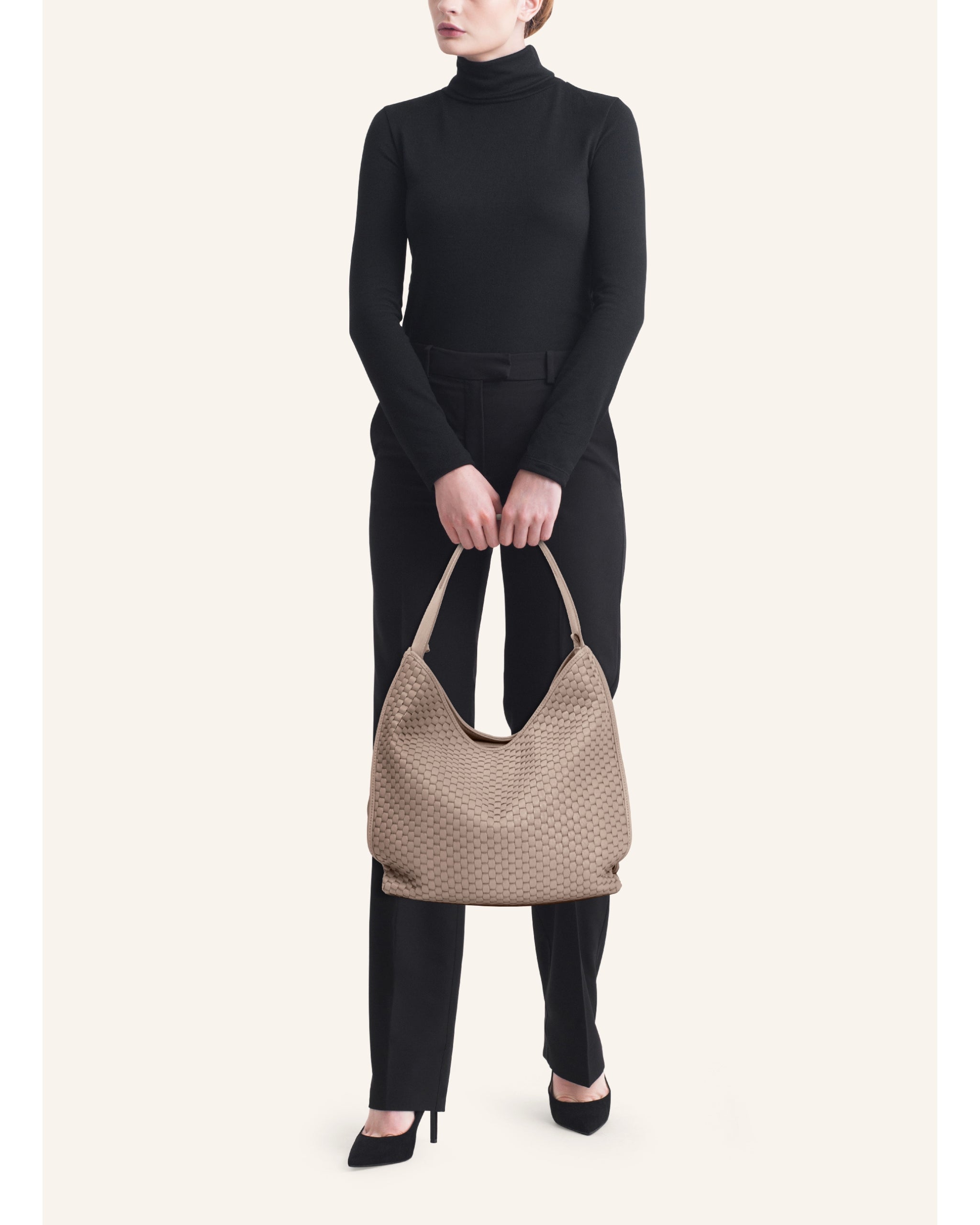 Model carrying the Parise ‘697’ Hobo Bag in acacia on the shoulder, illustrating scale and drape for everyday wear.