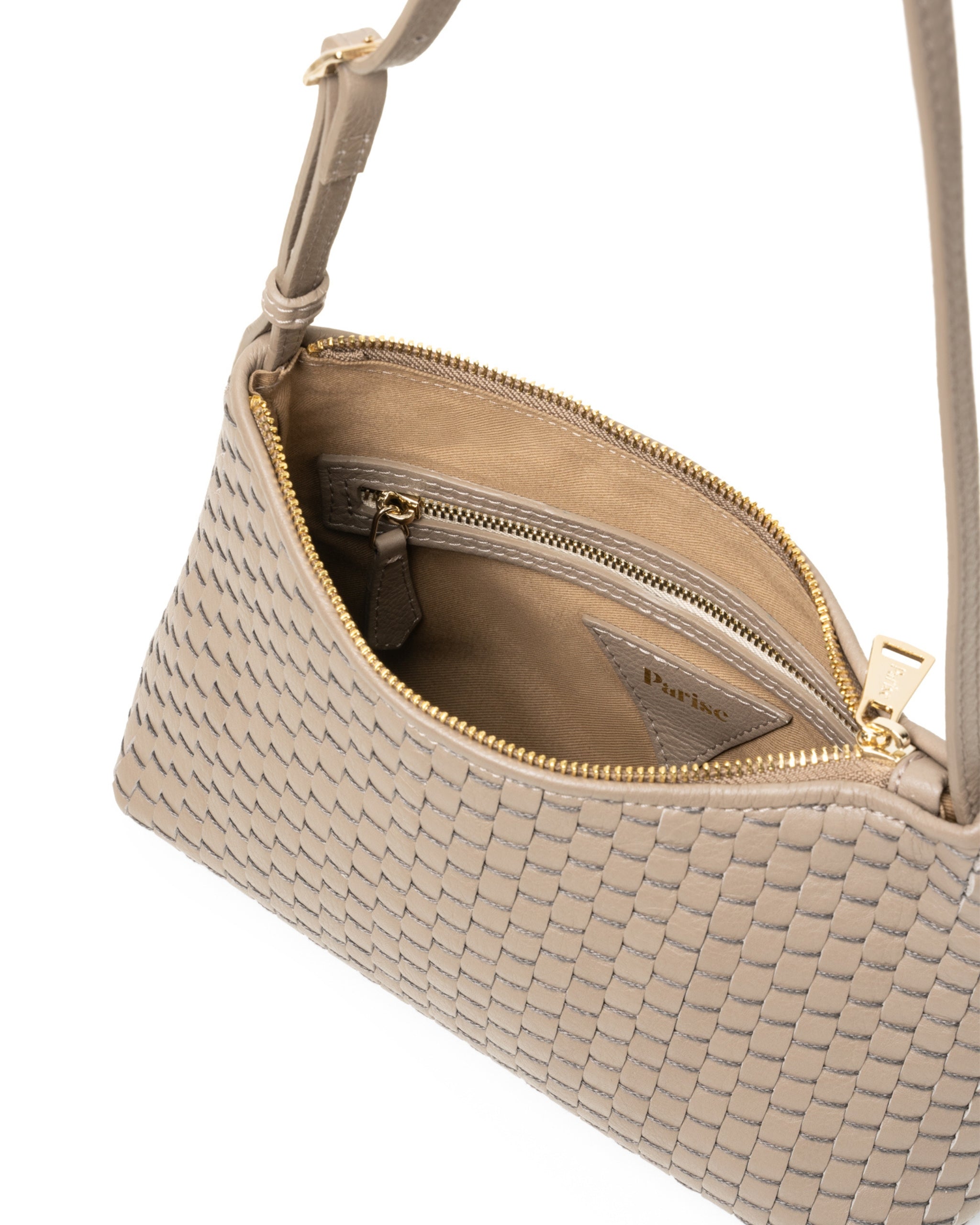 Inside of the Parise ‘81’ Baguette Bag in Acacia featuring soft cotton lining and zip closure detail.