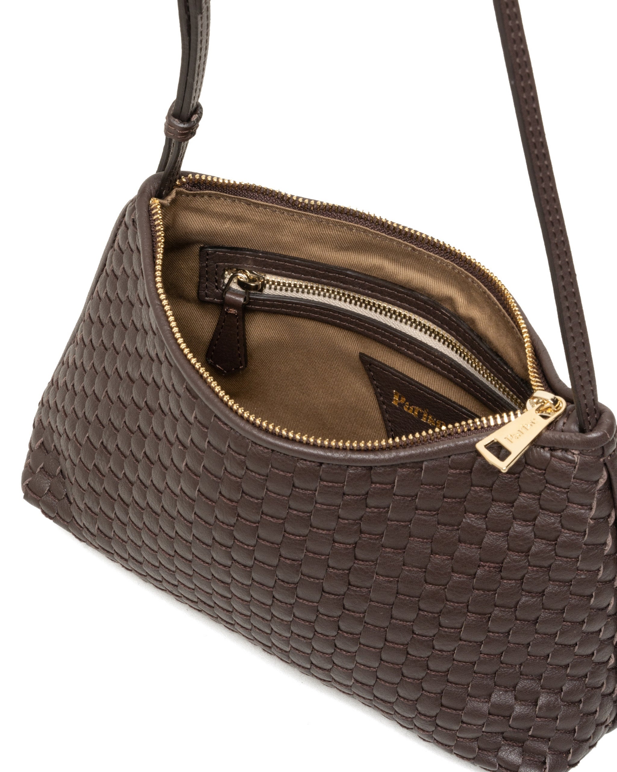 Inside of the Parise ‘81’ Baguette Bag in ebony featuring soft cotton lining and zip closure detail.