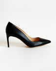 Rupert Sanderson New Nada in Black Heel, a timeless classic crafted in soft black leather. Its elegant silhouette is complemented by a slim 75mm stiletto heel. Handmade in Italy. Shown from the side.
