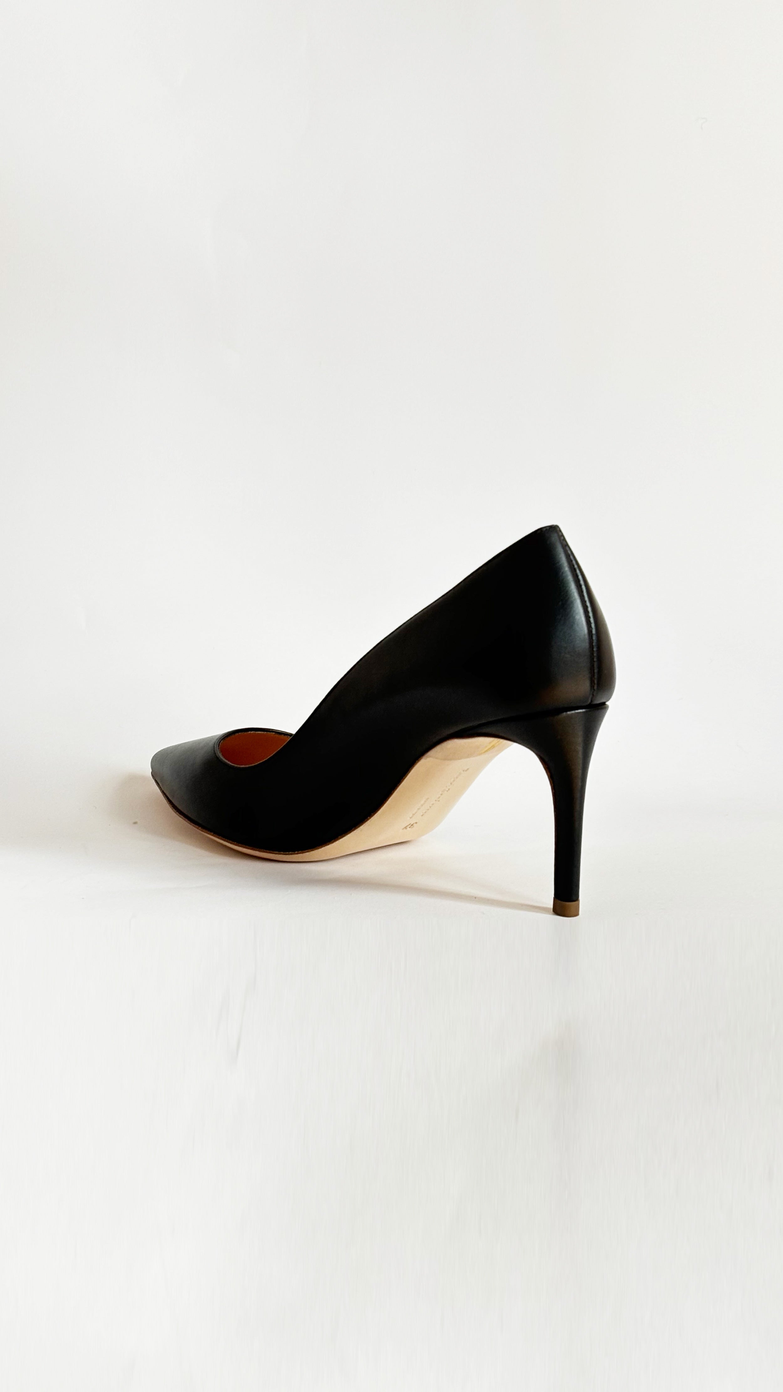 Rupert Sanderson New Nada in Black Heel, a timeless classic crafted in soft black leather. Its elegant silhouette is complemented by a slim 75mm stiletto heel. Handmade in Italy. Shown from the back.