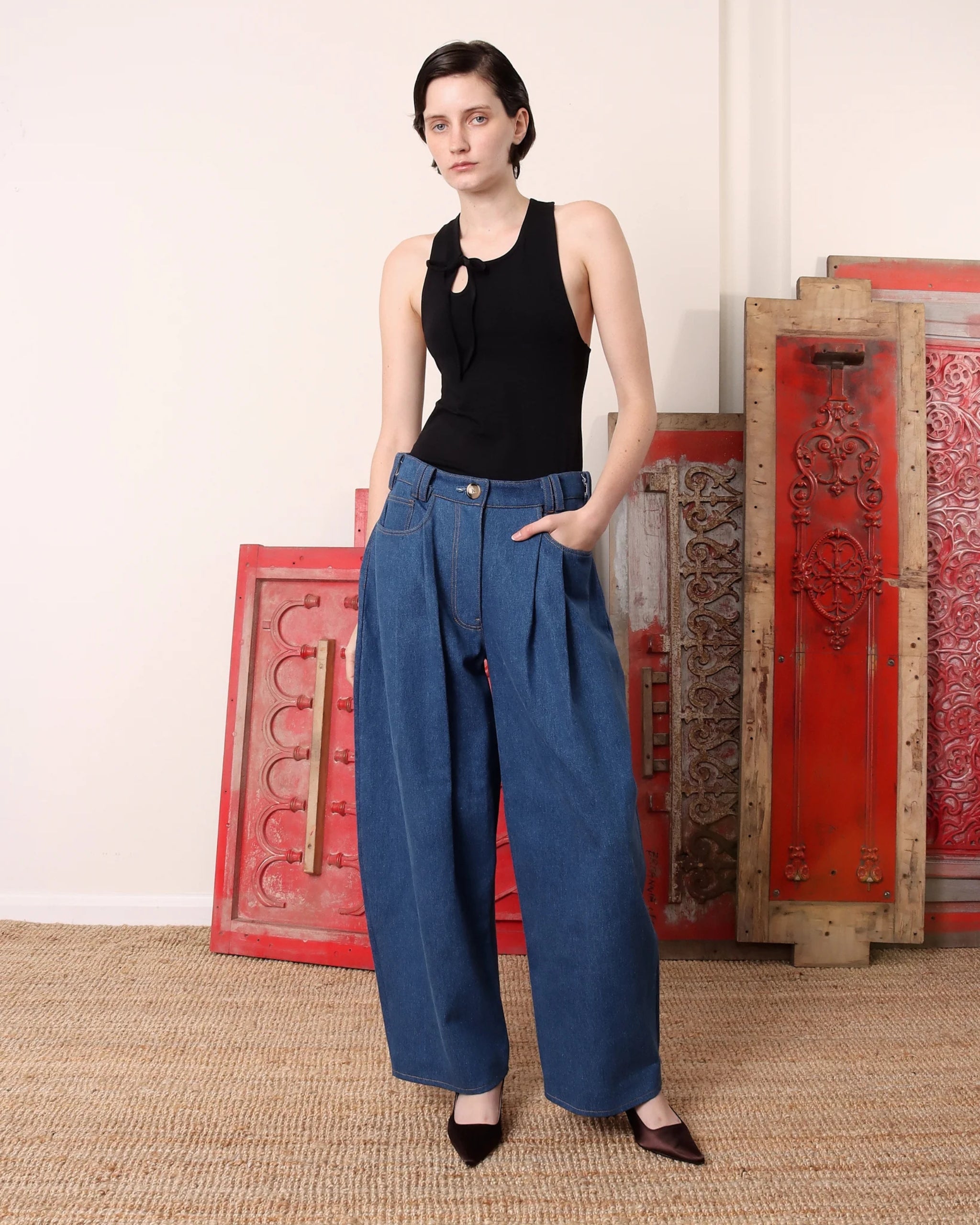 Model wearing S.S. Daley wide-leg jeans in light blue denim with slightly ballooned leg and relaxed fit.