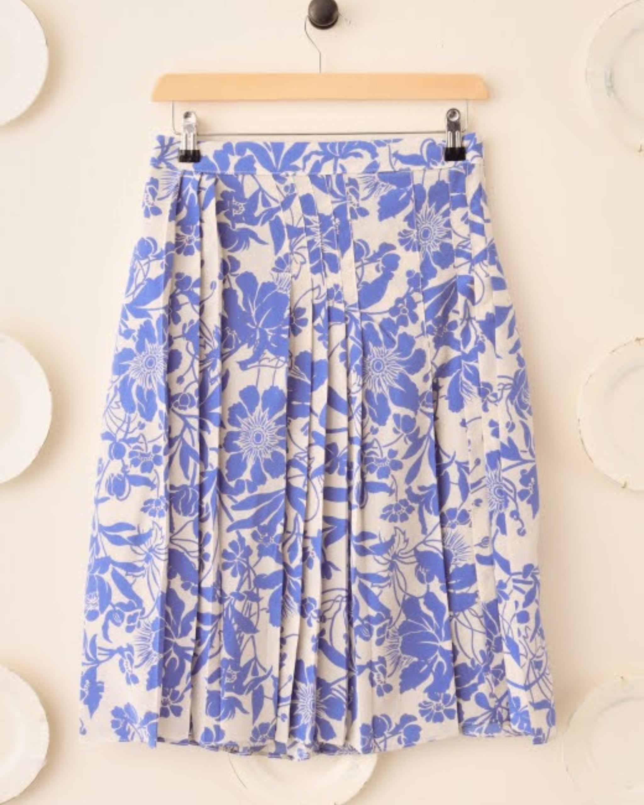 Front view of S.S. Daley Wilma Floral Silk Pleated Skirt in white and blue cut-out floral motif
