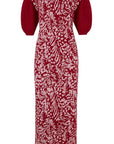Clea Stuart Carmesi Feathers Dress. Luxury knitwear dress in burgundy and pink. The dress features mid length balloon sleeves and is midi length. There is a subtle weave of metallic threading, giving the dress an elegant look. Product photo shown from the front view.
