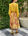 Alexandre Blanc Cowl Neck Dress Silk Yellow and Pink with leopard skirt pattern. Elegant dress for party or wedding. Midi length. Shown on model back view.