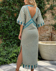 Dodo Bar Or Tor Dress Woven Lamb leather super luxurious dress. Deep v neck in blue green and cream. Slightly open v back. Midi length dress. Leather fringe detail. New collection Pre Fall experience 27. Shown in model back view.