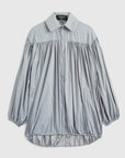 Rochas Paris Fashion Oversized Wind Jacket in a sky silver blue. Pleated draping across the front makes this elegant and luxurious outerwear jacket. Product photo shown from the front. 