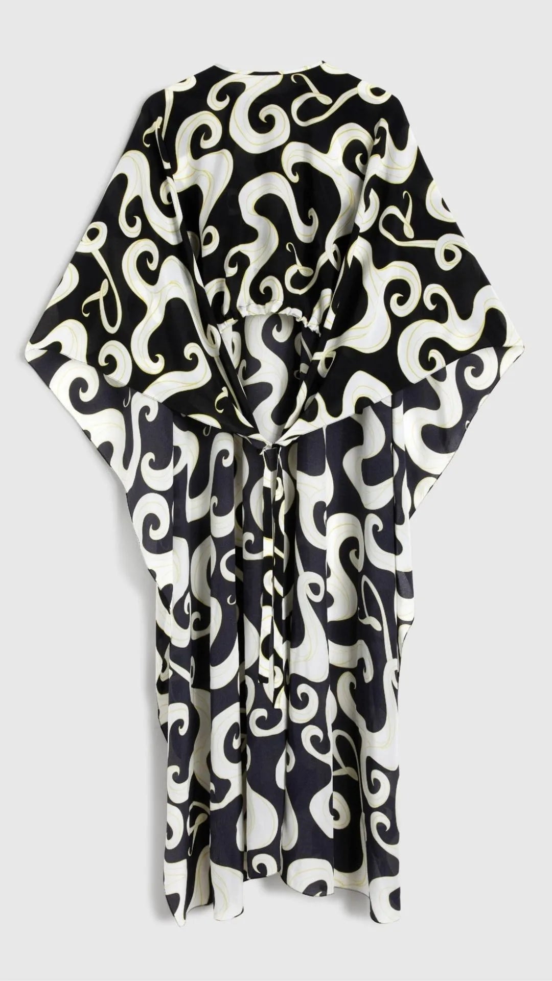 Rochas Paris Fashion Asymmetrical Fluid Top. With a waist length front and a dramatic caped back. Crafted in crepe de chine in a black and white pattern with yellow highlights. This photo is a product shot facing the front.