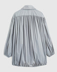 Rochas Paris Fashion Oversized Wind Jacket in a sky silver blue. Pleated draping across the front makes this elegant and luxurious outerwear jacket. Product photo shown from the back. 