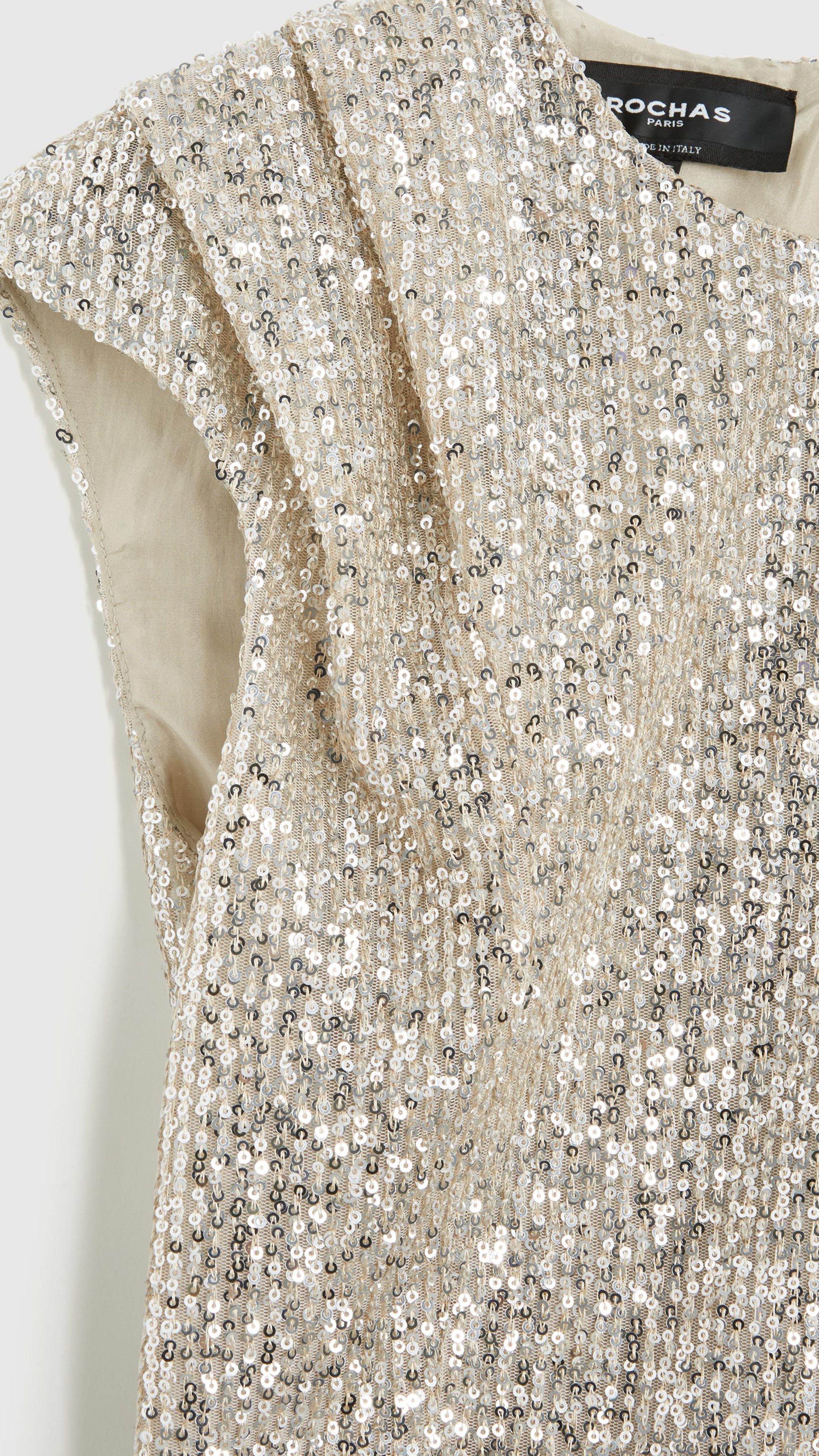 Rochas Paris Fashion Rounded Collar Sparkle Top Fitted Sleeveless Blouse with pleated shoulders in a silver sequins. Detail photo showing material and shoulder