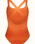 Talia Collins Cross Back Swimsuit in Terracotta Orange. Sustainable swimwear made from recycled materials. One piece classic swimsuit style with cross straps in the back. Scoop neck with full coverage bikini bathing suit top and bum coverage. Experience 27 Madrid. Product back view.