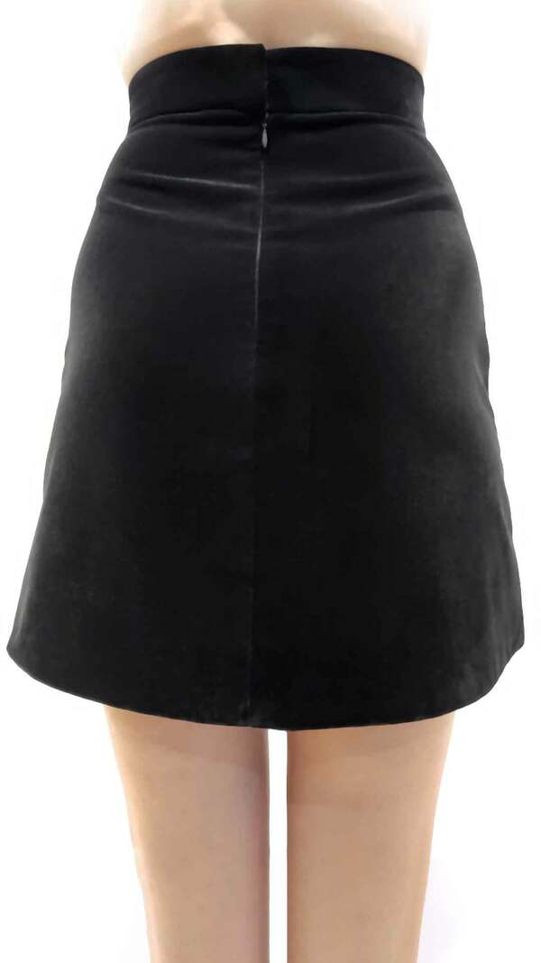 The Vampire&#39;s Wife Nearly Nuthin&#39; Skirt Crafted from deep black velvet and lined in silk, The Nearly Nuthin&#39; skirt has a mini length with a high waist-accentuating fit. A-line silhouette. Concealed zipper closure at back. Fully lined in black silk. 