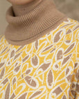 Clea Stuart silk and cotton knit. Oversized comfortable dress with turtle neck in yellow, taupe and ecru.  Close up of turtle neck.